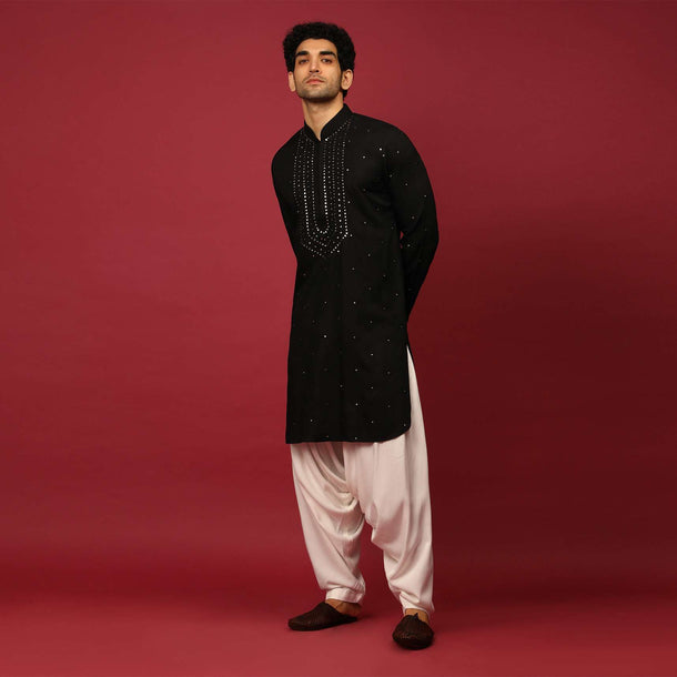 Black Pathani Suit In Cotton With Mirror And Thread Embroidered Buttis And Heavy Placket Design