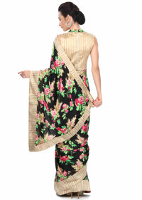 Black saree adorn in floral pinrt and silk border only on Kalki