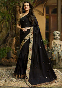 Black saree embellished in ikkat motif embroidery Online - Kalki Fashion