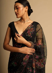 Black Saree In Organza With Floral Print All Over And Scalloped Resham Border Along With Unstitched Blouse