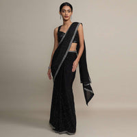 Black chiffon saree with heavy cut dana and pot embroidered border only on Kalki
