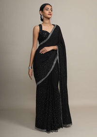 Black chiffon saree with heavy cut dana and pot embroidered border only on Kalki