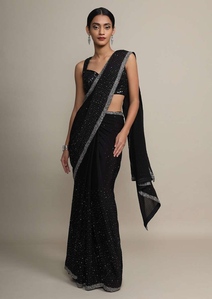 Black chiffon saree with heavy cut dana and pot embroidered border only on Kalki