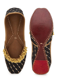 Black Geometric Print Juttis In Silk With Ghungroo Embellishment