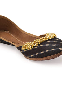 Black Geometric Print Juttis In Silk With Ghungroo Embellishment
