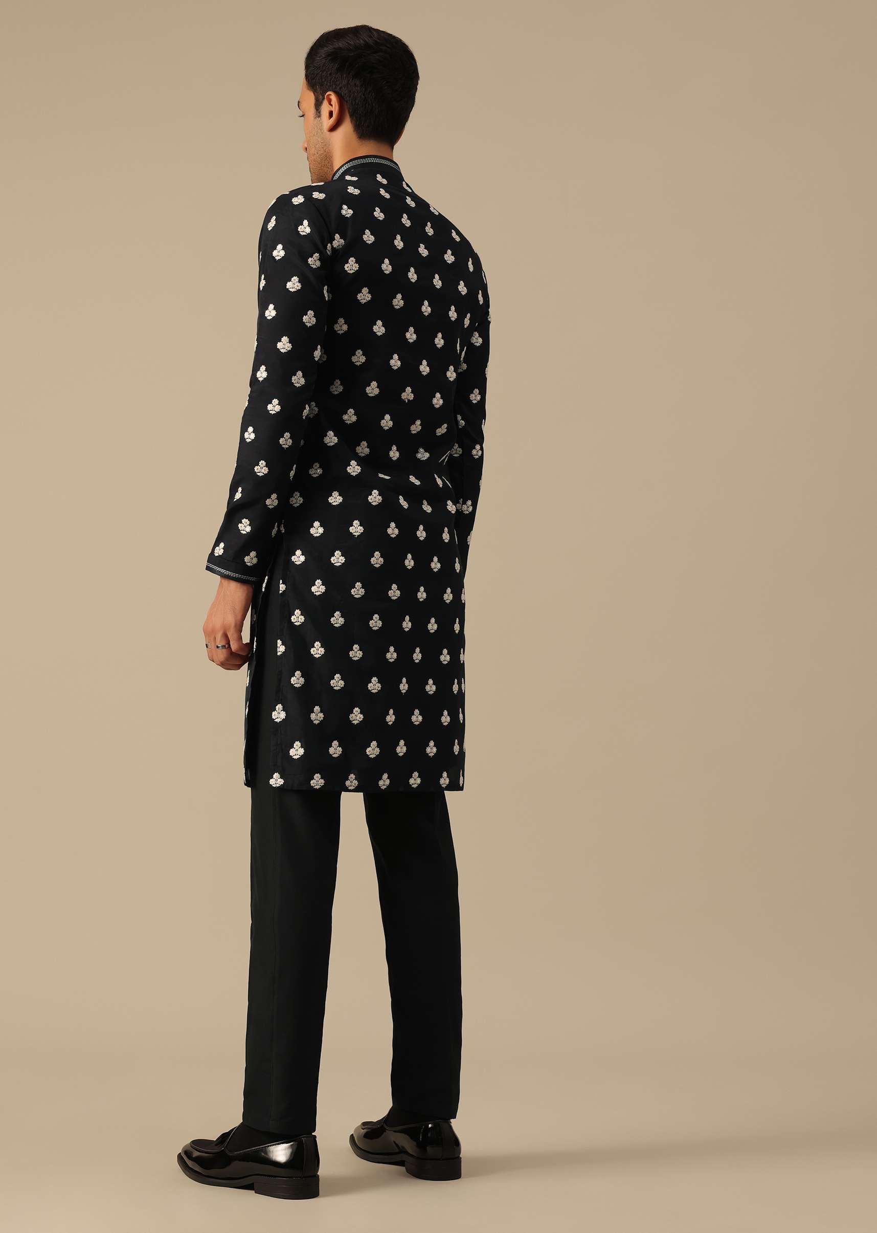 Black kurta and pant set with floral motif embellishments
