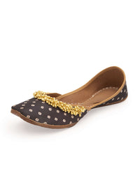 Black Print Juttis In Silk With Ghungroo Embellishment And Geometric Print