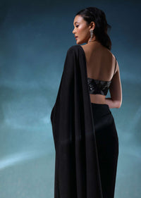 Black Saree In Pleated-Knit Fabric With A Heavily Embroidered Blouse
