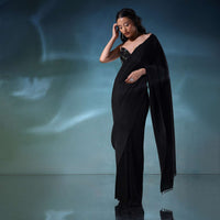 Black Saree In Pleated-Knit Fabric With A Heavily Embroidered Blouse