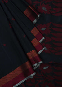 Black saree in silk beautified in weaved embroidery only on Kalki