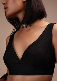 Black Sleeveless Blouse In A Sweetheart Neck Line Straight Hem Line With Back Zip Closure