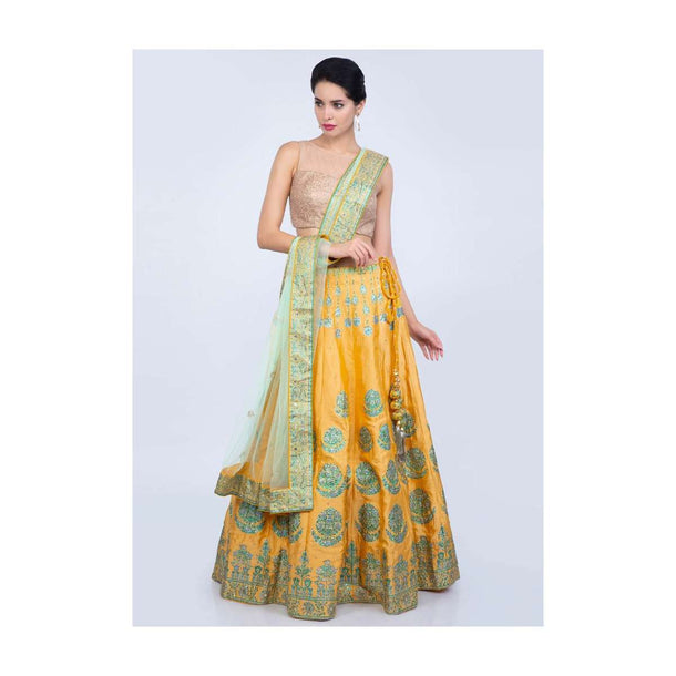 Blonde yellow printed cotton silk lehenga with contrasting pista green net dupatta only on Kalki