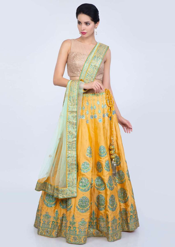 Blonde yellow printed cotton silk lehenga with contrasting pista green net dupatta only on Kalki