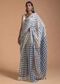 Blue And White Saree In Linen With Woven Stripes And Chain Stitch Embroidered Floral Buttis Online - Kalki Fashion