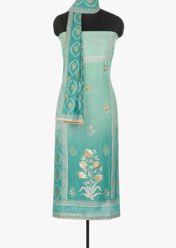 Blue shaded cotton silk unstitched suit embellished in foil printed butti only on Kalki