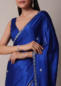 Blue Satin Saree With Stone Embellished Border And Unstitched Blouse Piece