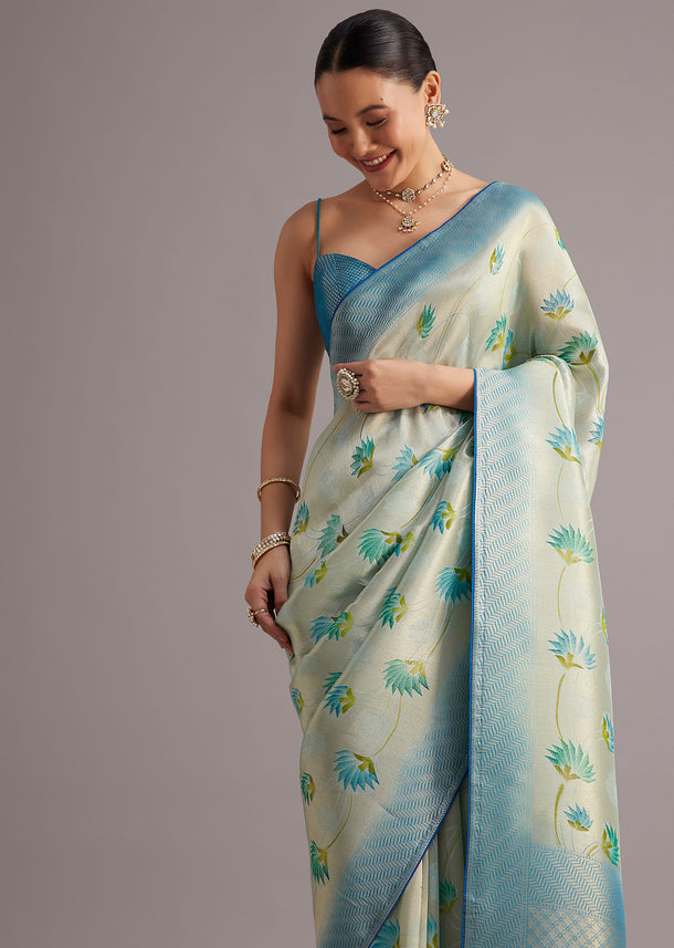 Blue Tissue Silk Saree With Floral Motifs And Contrast Pallu And Border