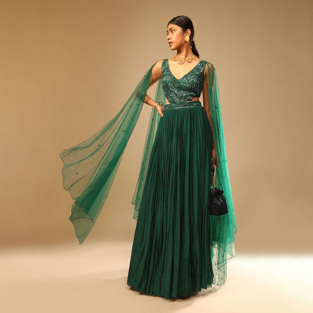 Bottle Green Gown In Crepe With Side Cut Outs In The Hand Embroidered Bodice