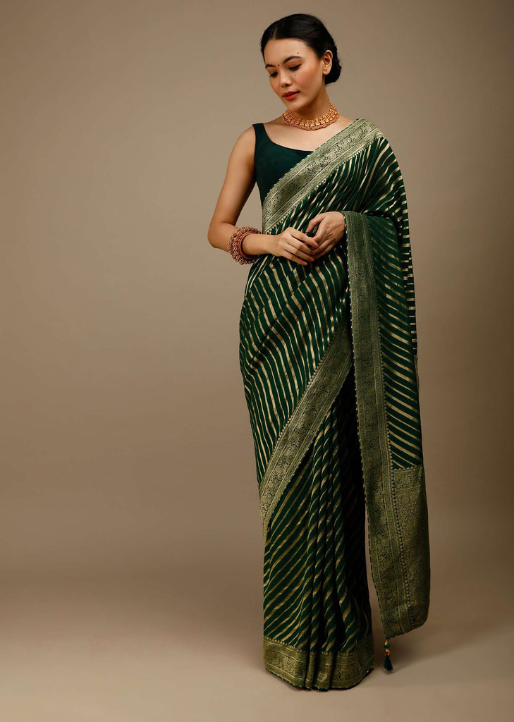 Bottle Green Saree In Georgette With Brocade Woven Diagonal Stripes And Floral Border