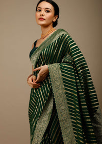 Bottle Green Saree In Georgette With Brocade Woven Diagonal Stripes And Floral Border