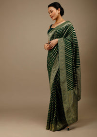 Bottle Green Saree In Georgette With Brocade Woven Diagonal Stripes And Floral Border