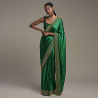 Bottle Green Saree In Satin Blend With Sequins And Zardosi Embroidered Border Design And Unstitched Blouse Online - Kalki Fashion