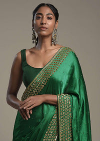 Bottle Green Saree In Satin Blend With Sequins And Zardosi Embroidered Border Design And Unstitched Blouse Online - Kalki Fashion