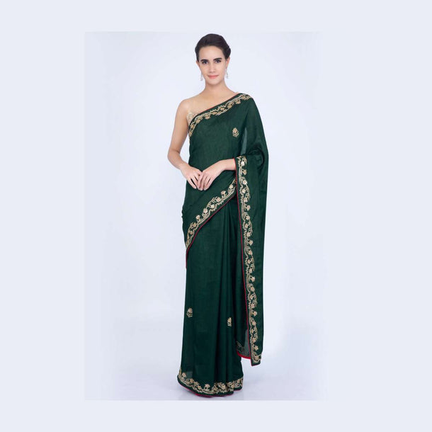 Bottle green silk saree with embroidered butti and border only on Kalki