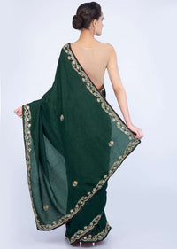 Bottle green silk saree with embroidered butti and border only on Kalki