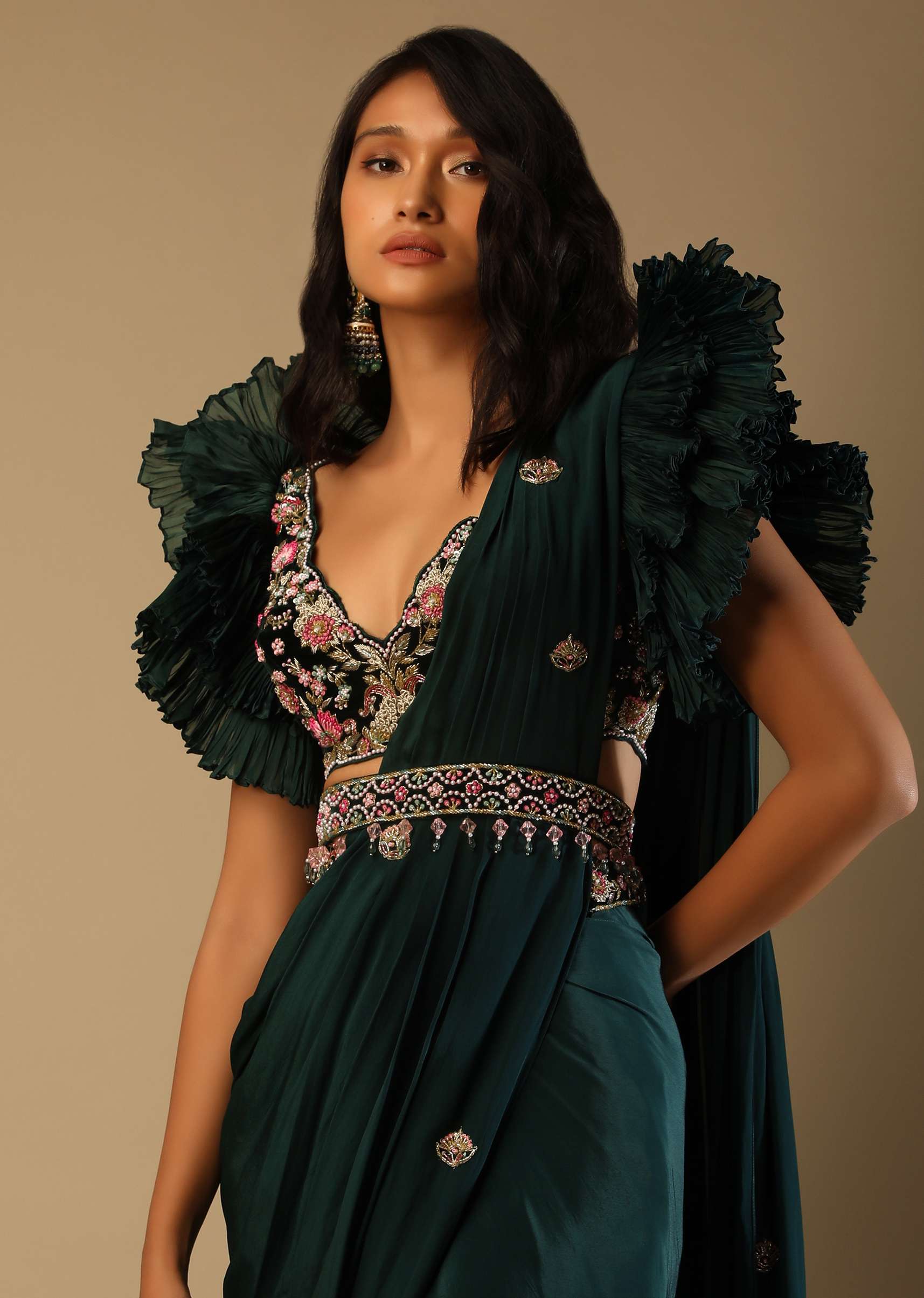 Bottle Green Ready Pleated Saree With A Colorful Hand Embroidered Blouse With Fancy Layered Frill Sleeves