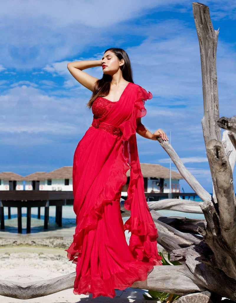 Bright Red Ready Pleated Saree With Ruffled Pallo Paired With A Strapless Hand Embroidered Blouse