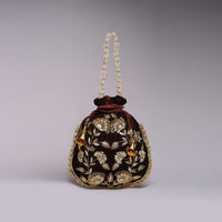 Burgandy Potli Bag In Velvet With Hand Embroidered Floral Design Using Sequins And Zardosi