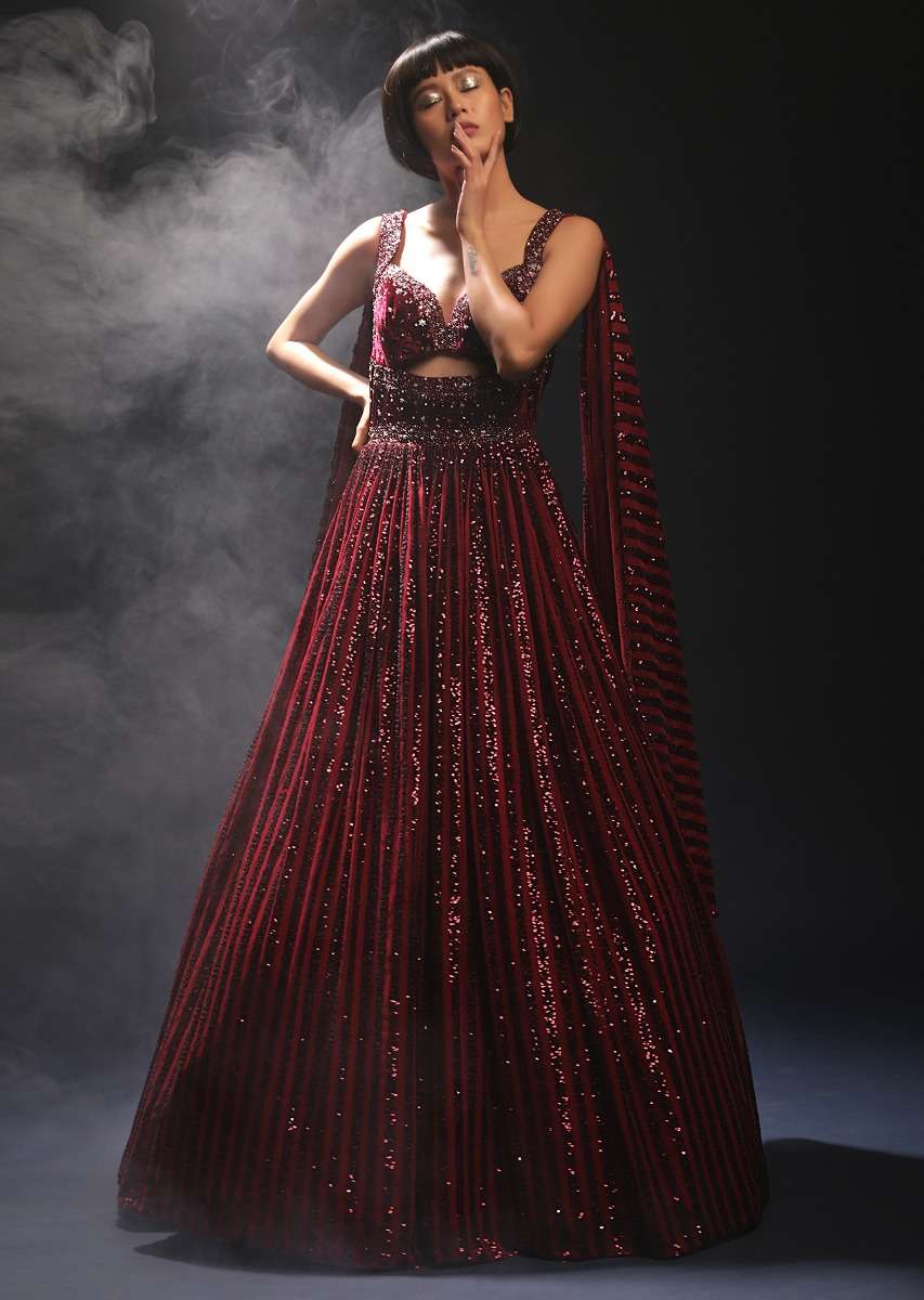 Burgundy Gown In Sequins Embellished Net With Attached Cape And Cut Dana Accented Front Cut Bodice