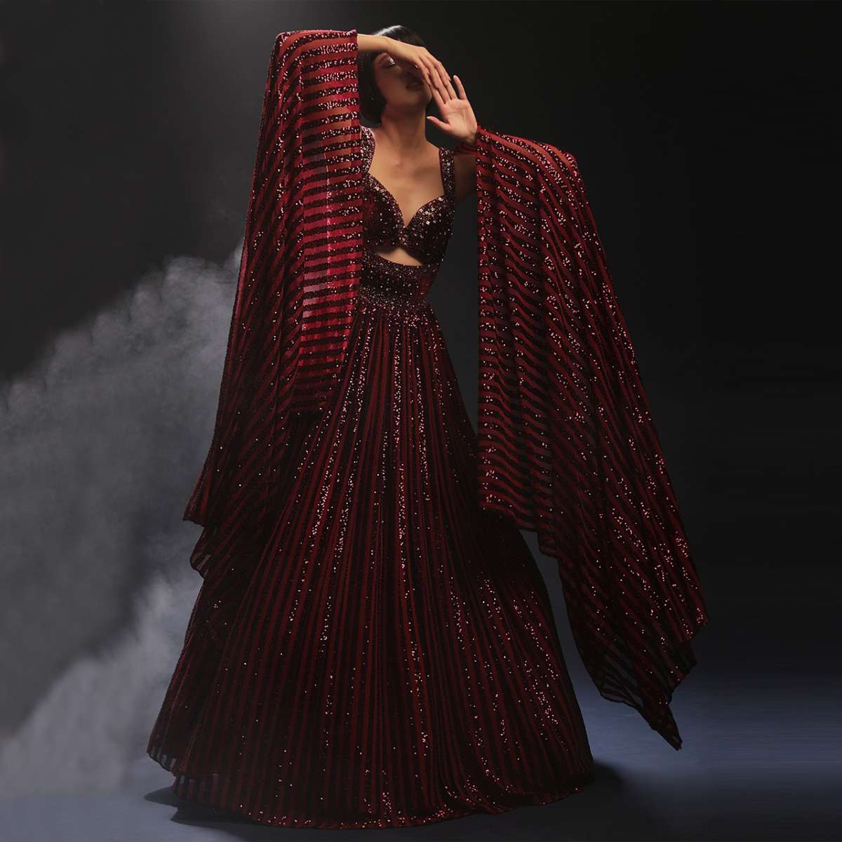 Burgundy Gown In Sequins Embellished Net With Attached Cape And Cut Dana Accented Front Cut Bodice