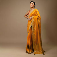 Cadmium Yellow Saree In Dola Silk With Lurex Woven Stripes On The Pallu And Geometric Floral Motifs On The Pleats