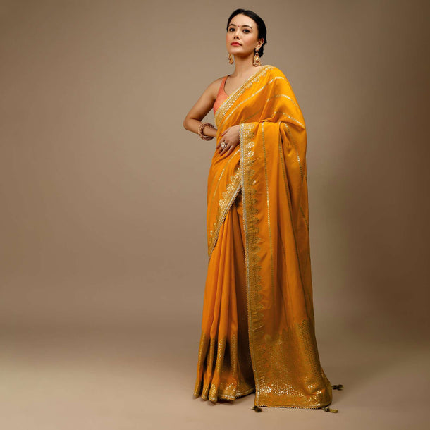 Cadmium Yellow Saree In Dola Silk With Lurex Woven Stripes On The Pallu And Geometric Floral Motifs On The Pleats