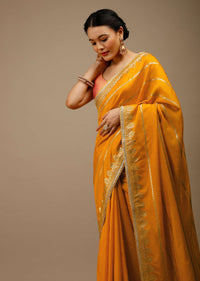 Cadmium Yellow Saree In Dola Silk With Lurex Woven Stripes On The Pallu And Geometric Floral Motifs On The Pleats