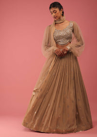 Camel Brown Crop Top And Lehenga Set In Gold Sequins Embroidery, Crafted In Georgette With Sequins Fringes On The Border Of The Lehenga