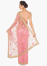 Candy pink saree in net adorn in 3D flower and cut dana jaal embroidery only on Kalki