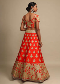 Candy Red Lehenga Choli In Raw Silk With Zari Embroidered Roses On The Hem And Floral Buttis Online - Kalki Fashion