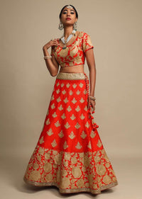 Candy Red Lehenga Choli In Raw Silk With Zari Embroidered Roses On The Hem And Floral Buttis Online - Kalki Fashion