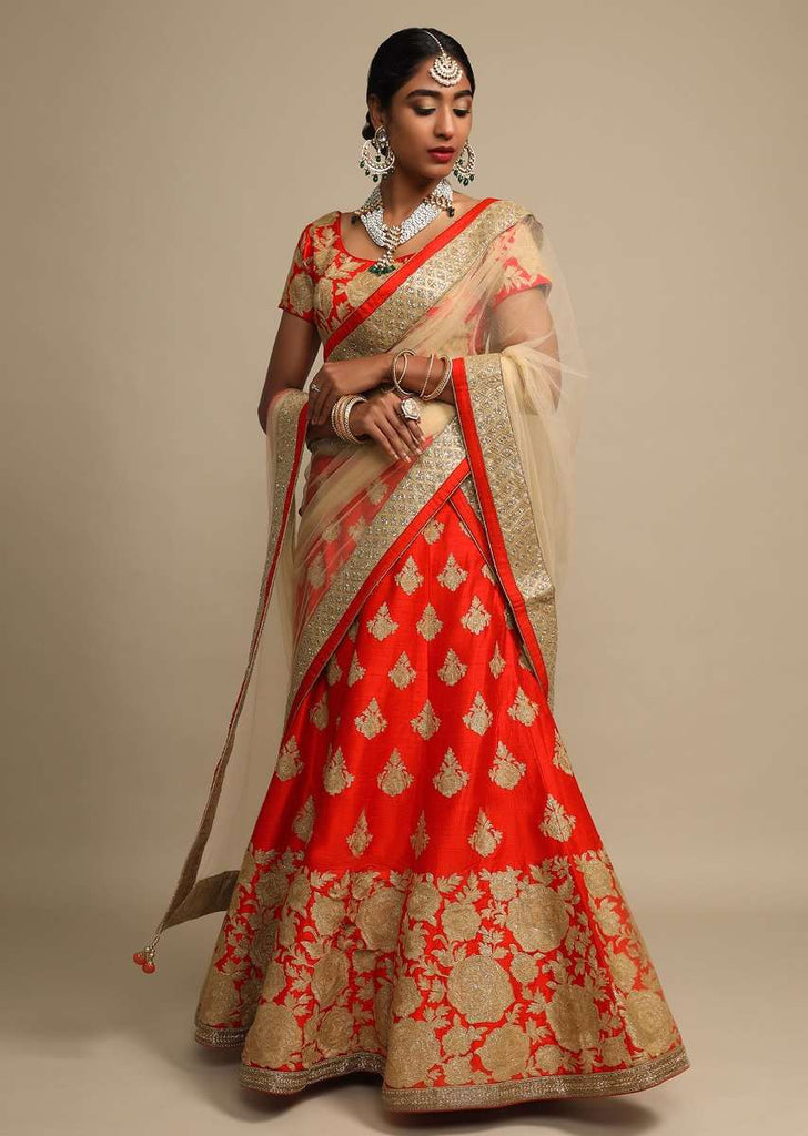 Candy Red Lehenga Choli In Raw Silk With Zari Embroidered Roses On The Hem And Floral Buttis Online - Kalki Fashion