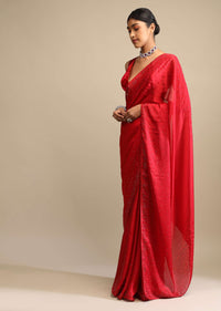 Candy Red Saree In Satin Embellished With Scattered Red And Silver Kundan Along The Border And Unstitched Blouse