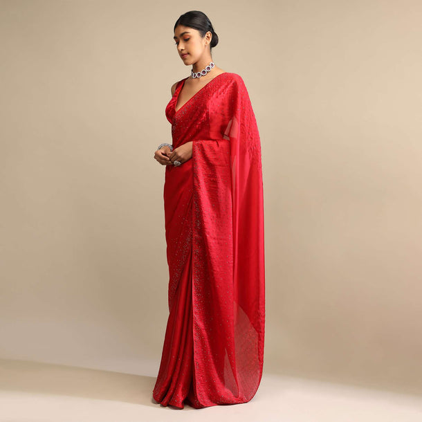 Candy Red Saree In Satin Embellished With Scattered Red And Silver Kundan Along The Border And Unstitched Blouse