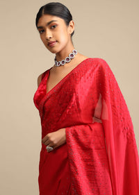 Candy Red Saree In Satin Embellished With Scattered Red And Silver Kundan Along The Border And Unstitched Blouse