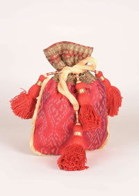 Carmine Red Potli In Ikkat Weave With Red Elaborate Tassel Dori Online - Kalki Fashion