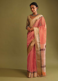 Carrot Coral Saree In Tussar Silk With A Contrasting Woven Golden Border And Textured Tussar Detailing On The Pallu