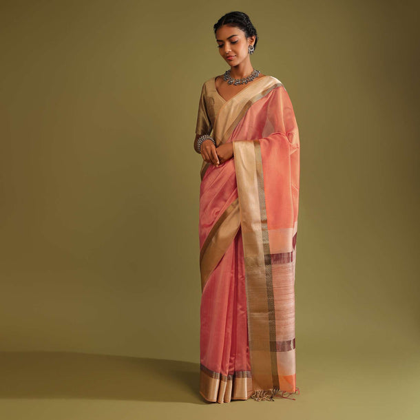 Carrot Coral Saree In Tussar Silk With A Contrasting Woven Golden Border And Textured Tussar Detailing On The Pallu