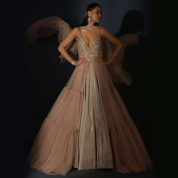 Champagne Tiered Gown With An Embellished Plunging V Cut Bodice And Shimmer Underlayer