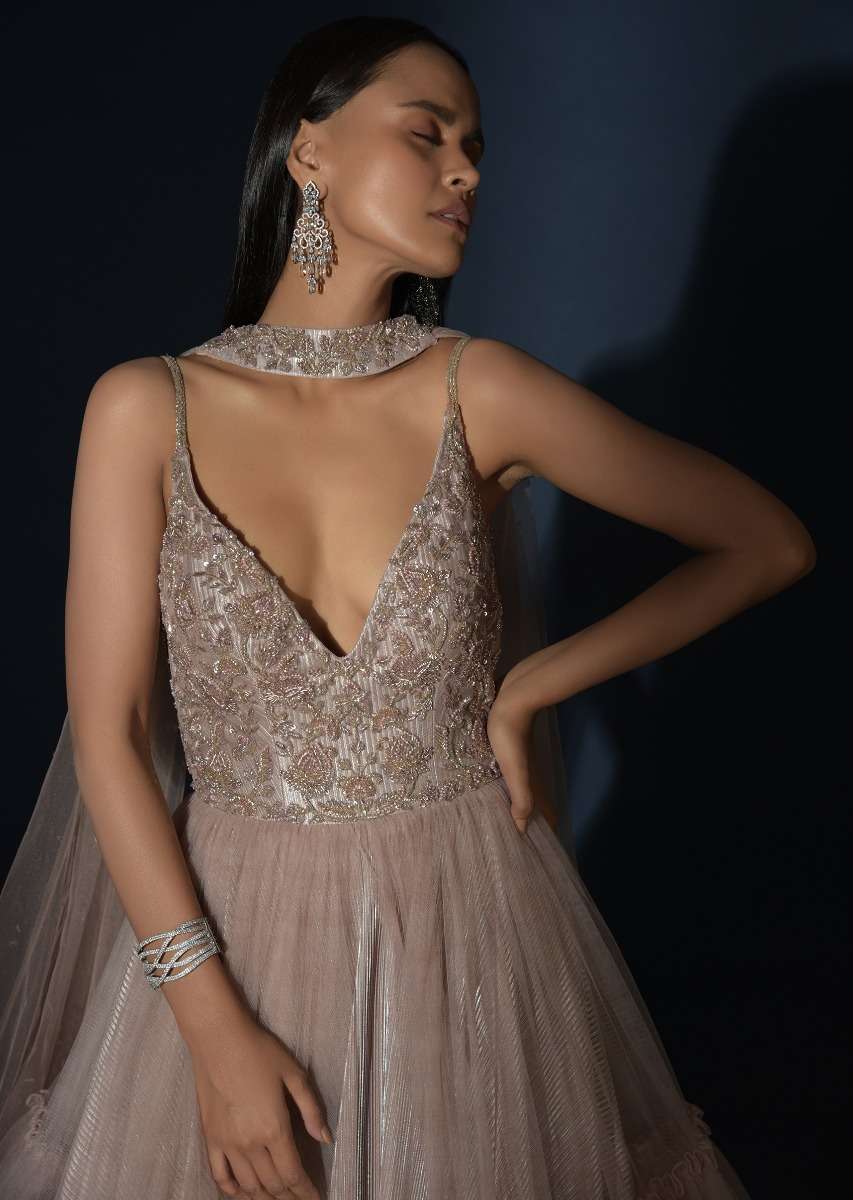 Champagne Tiered Gown With An Embellished Plunging V Cut Bodice And Shimmer Underlayer